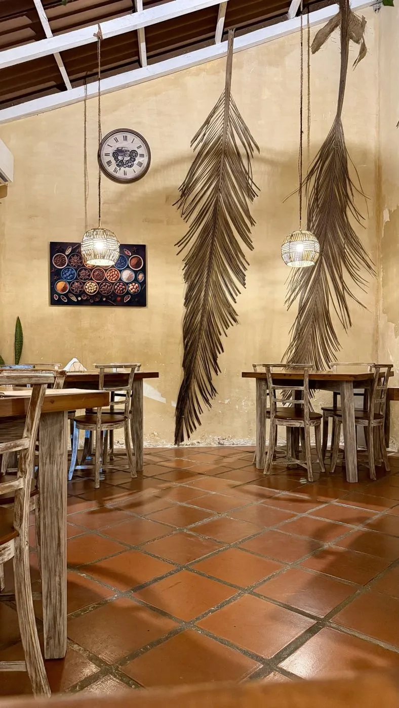 Inside: dried palm fronds and a spice painting