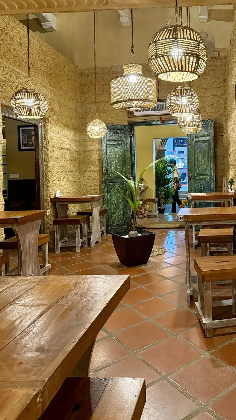 The lantern room with wicker lamps and green doors