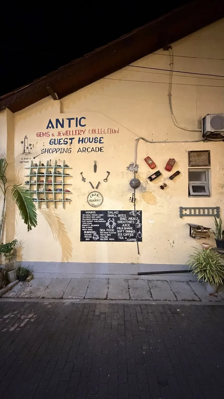 Antic guest house wall, with vintage keys, toy cars and a chalkboard menu