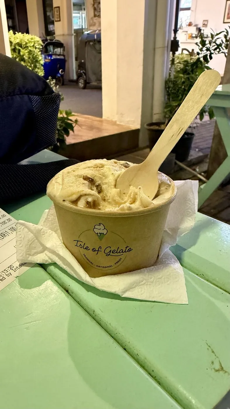 Gelato cup on the mint-green table, Galle Fort at night