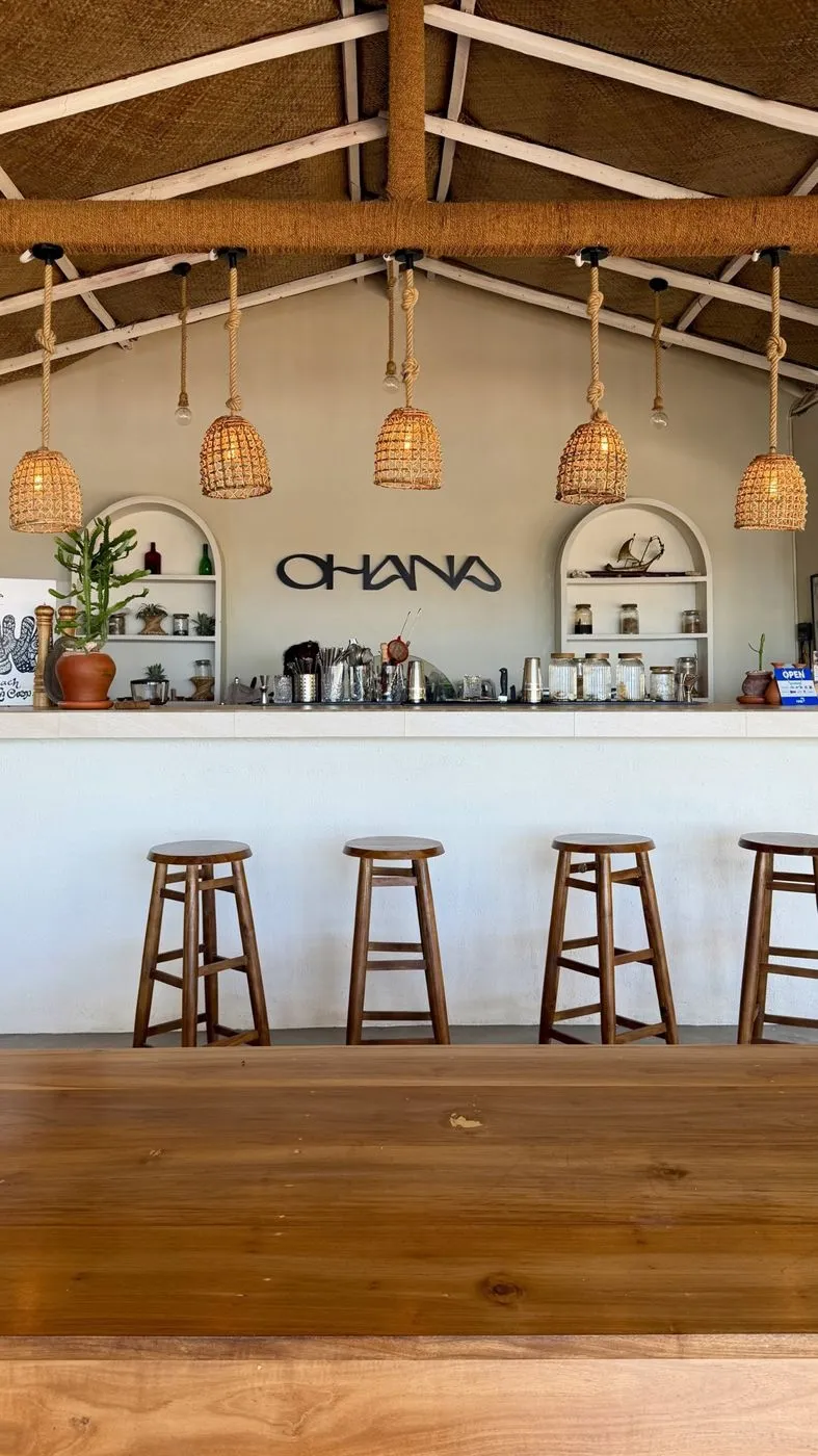 Ohana's bar under wicker lamps