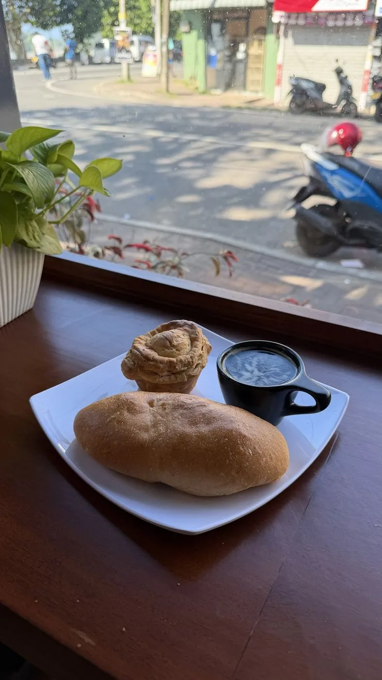 Espresso, a seeni sambol bun and a chicken and mushroom pastry at the window, LKR 520