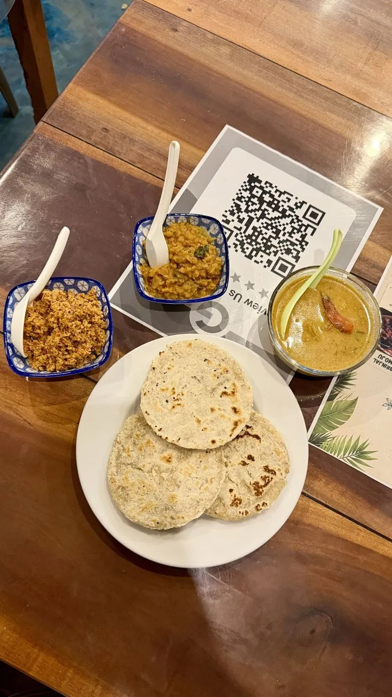 Coconut roti with pol sambol, dhal and coconut curry