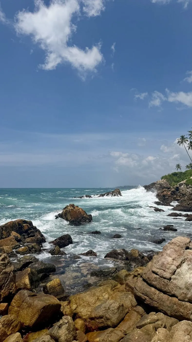 Waves breaking over the boulders at Secret Beach