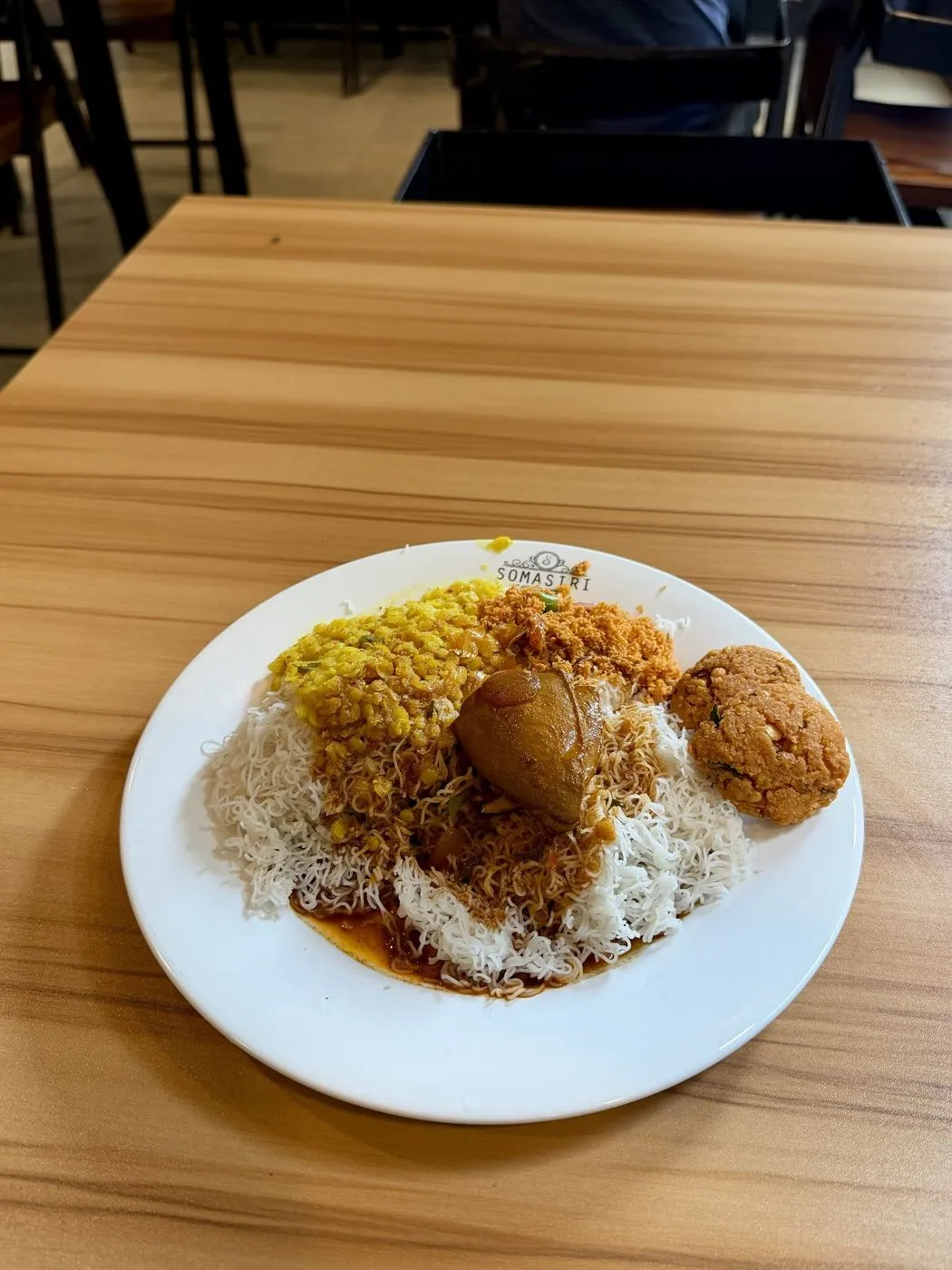 String hoppers with chicken curry, dhal, pol sambol and dhal vadai, LKR 800