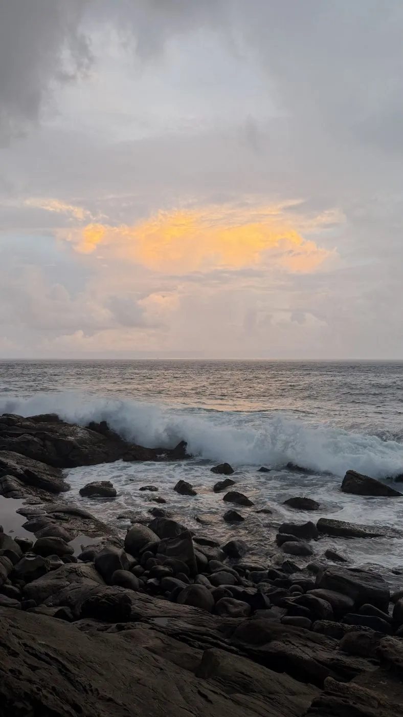 Sunset glow over a breaking wave
