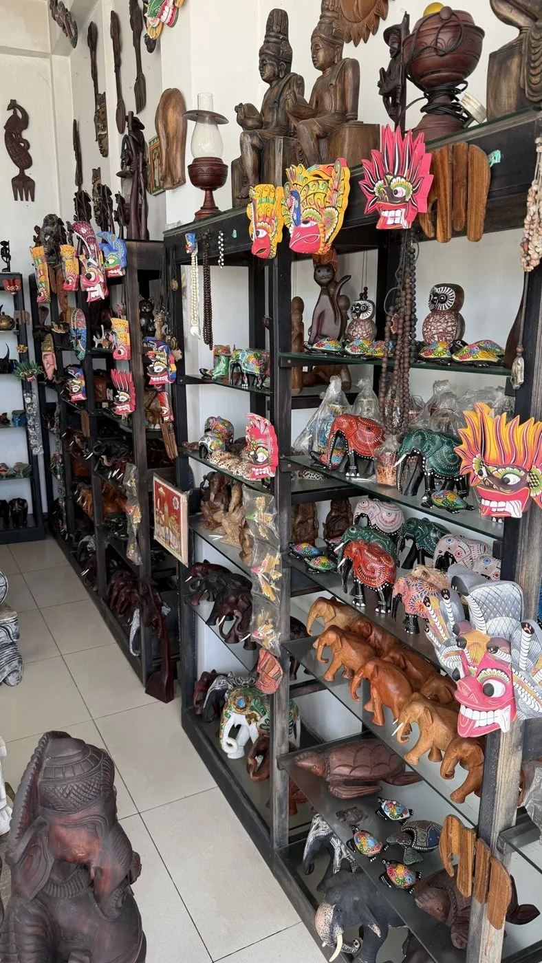Shelves of devil masks, hand-painted elephants and turtles